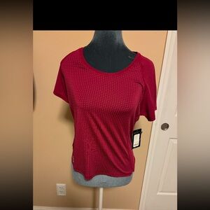 Korsa by Roadrunner short sleeve top with back cut out.